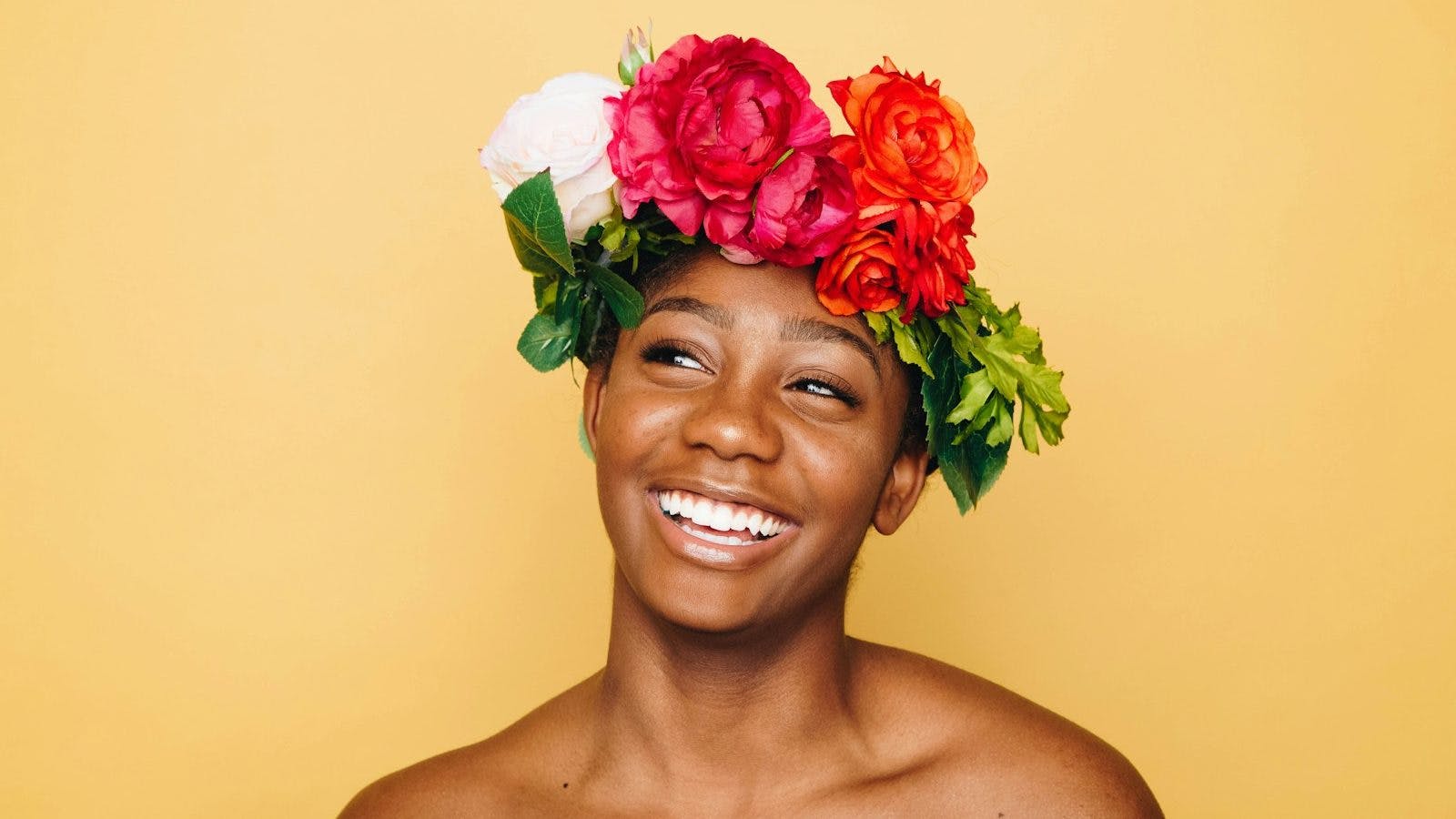 woman smiling wearing flower crown