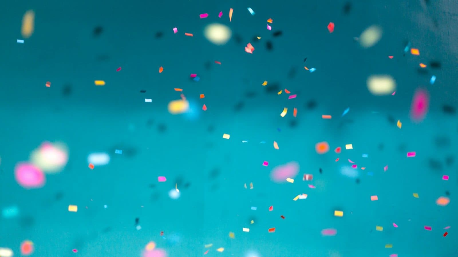 selective focus photography of multicolored confetti lot