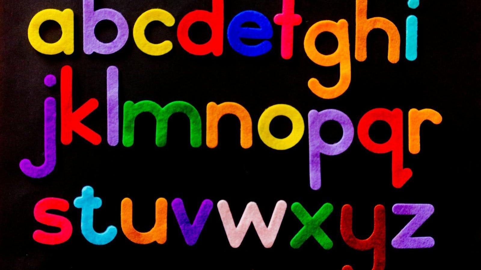 Alphabet Letter Text on Black Background