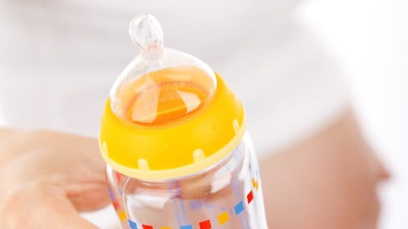 Baby's Feeding Bottle on Hand