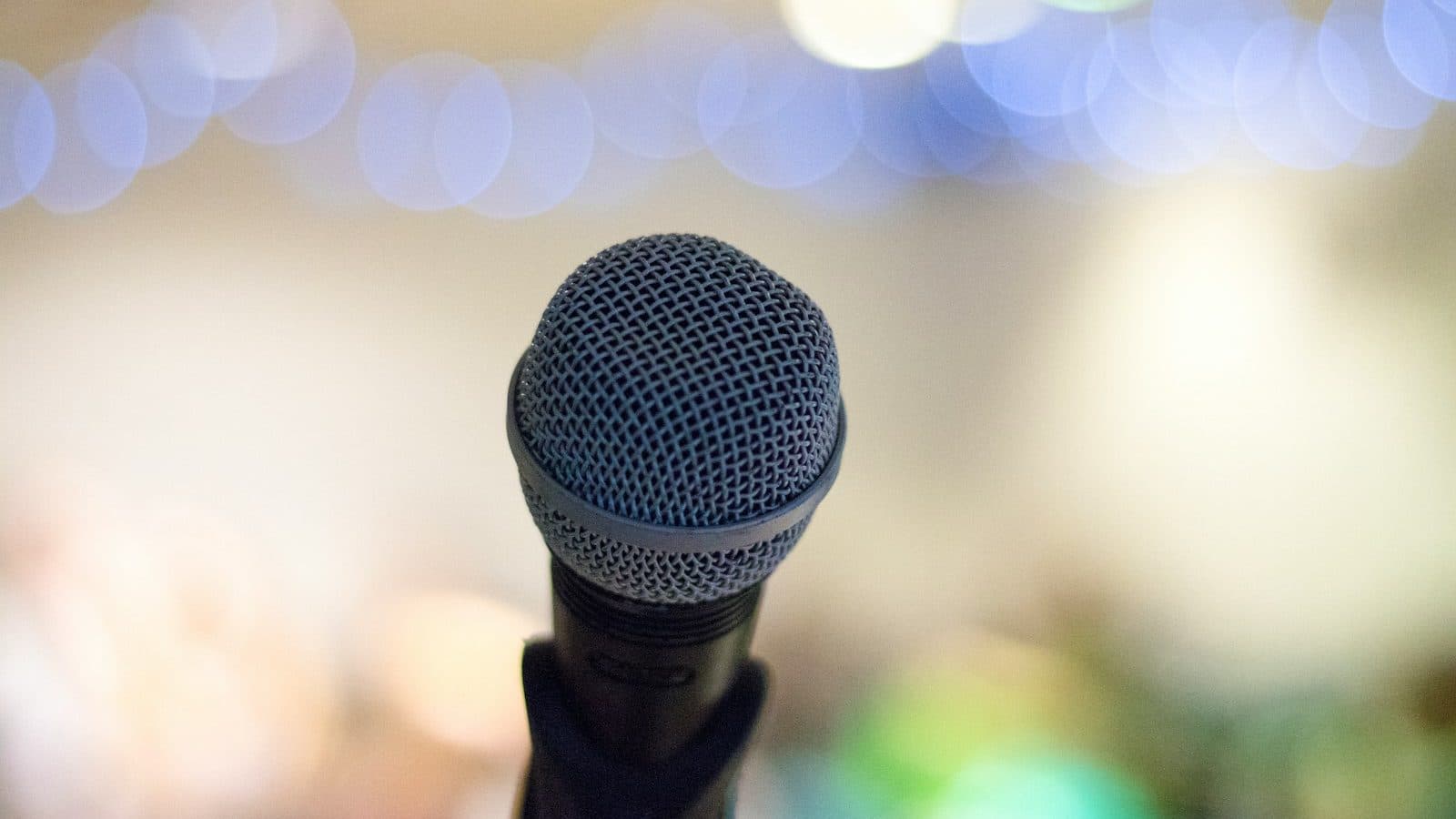 selective focus photography of microphone