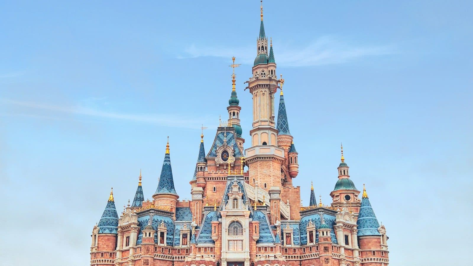 brown and blue concrete castle under blue sky during daytime