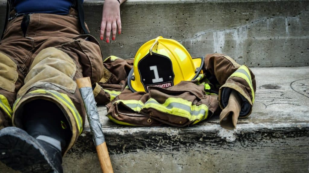 Yellow Hard Hat on Brown and Yellow Fireman's Suit