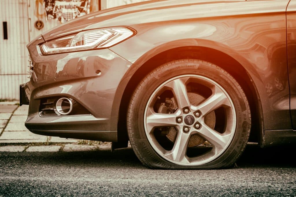 red mercedes benz c class flat tire