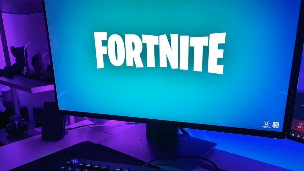 black flat screen computer monitor with black computer keyboard