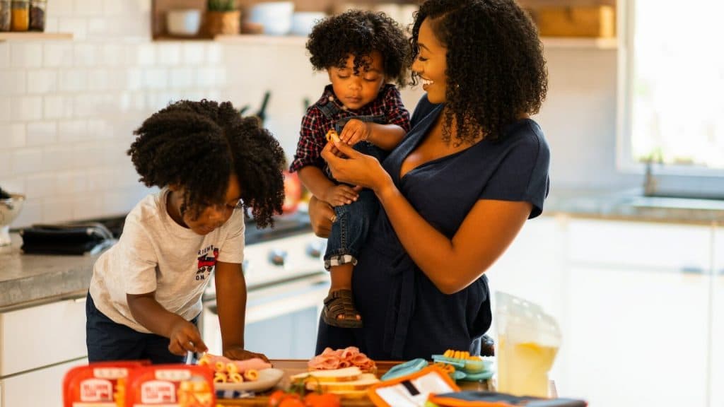 woman in black shirt sitting beside man in white t-shirt