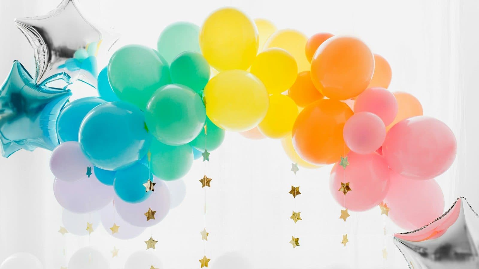 blue and yellow balloons with white clouds