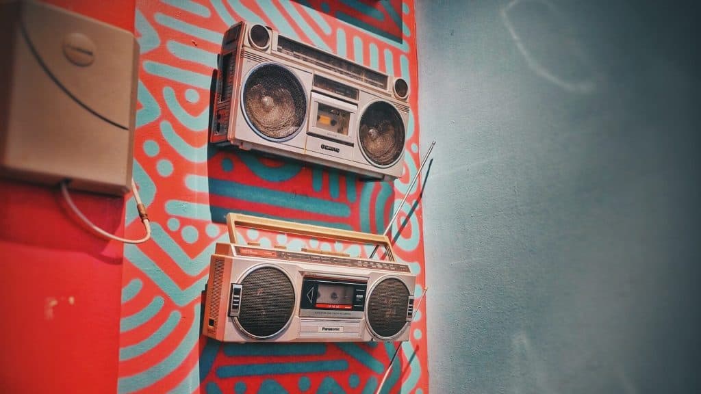 three gray boombox hanging on wall