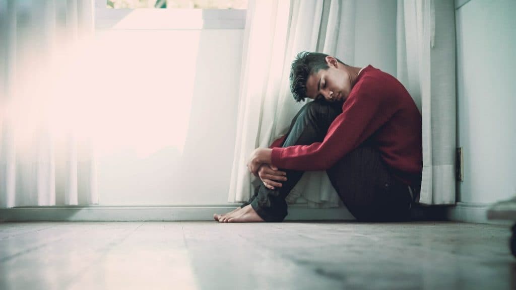 A man sitting near window