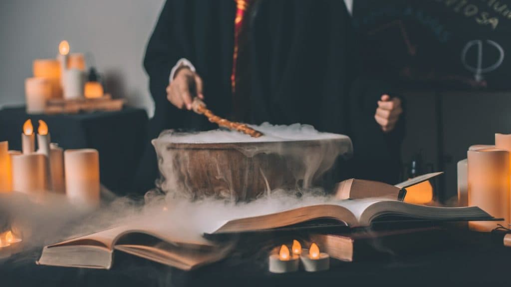 person holding wand on top of bowl