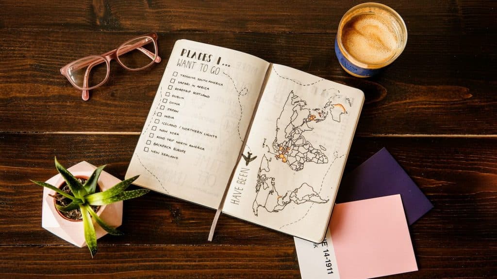 pink notebook and coffee