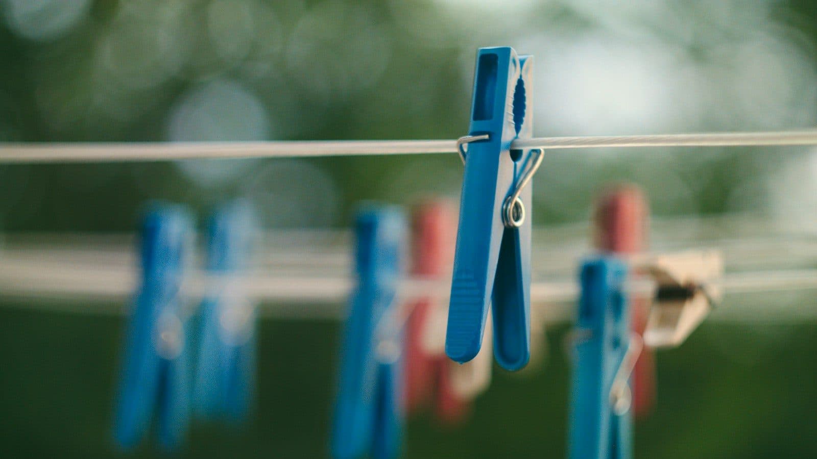 closeup photo of blue clothes peg