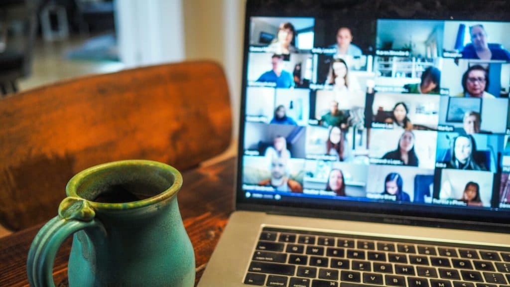 macbook pro displaying group of people