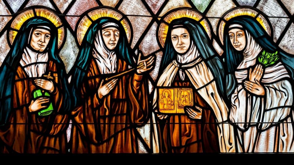 woman in white and blue dress painting